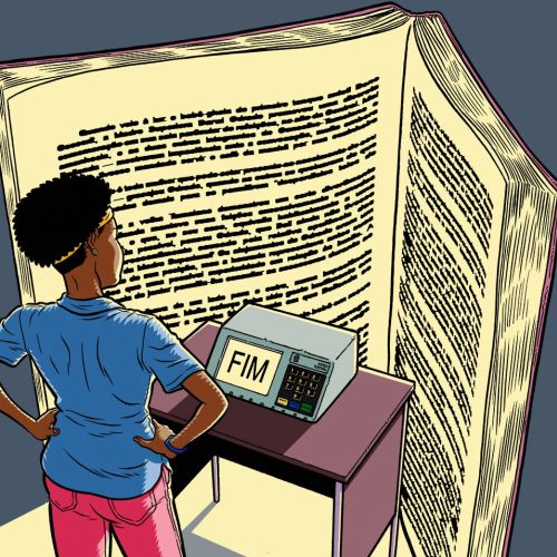 Person standing and reading an oversized open book with text