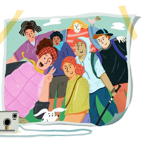 Friends smiling and posing for a selfie outdoors using a smartphone on a selfie stick.