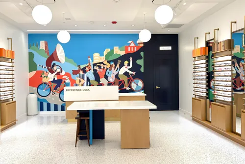 Warby Parker store interior with colorful mural and glasses display by Fangfang Han