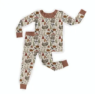 Children's pajama set with woodland animal and tree pattern