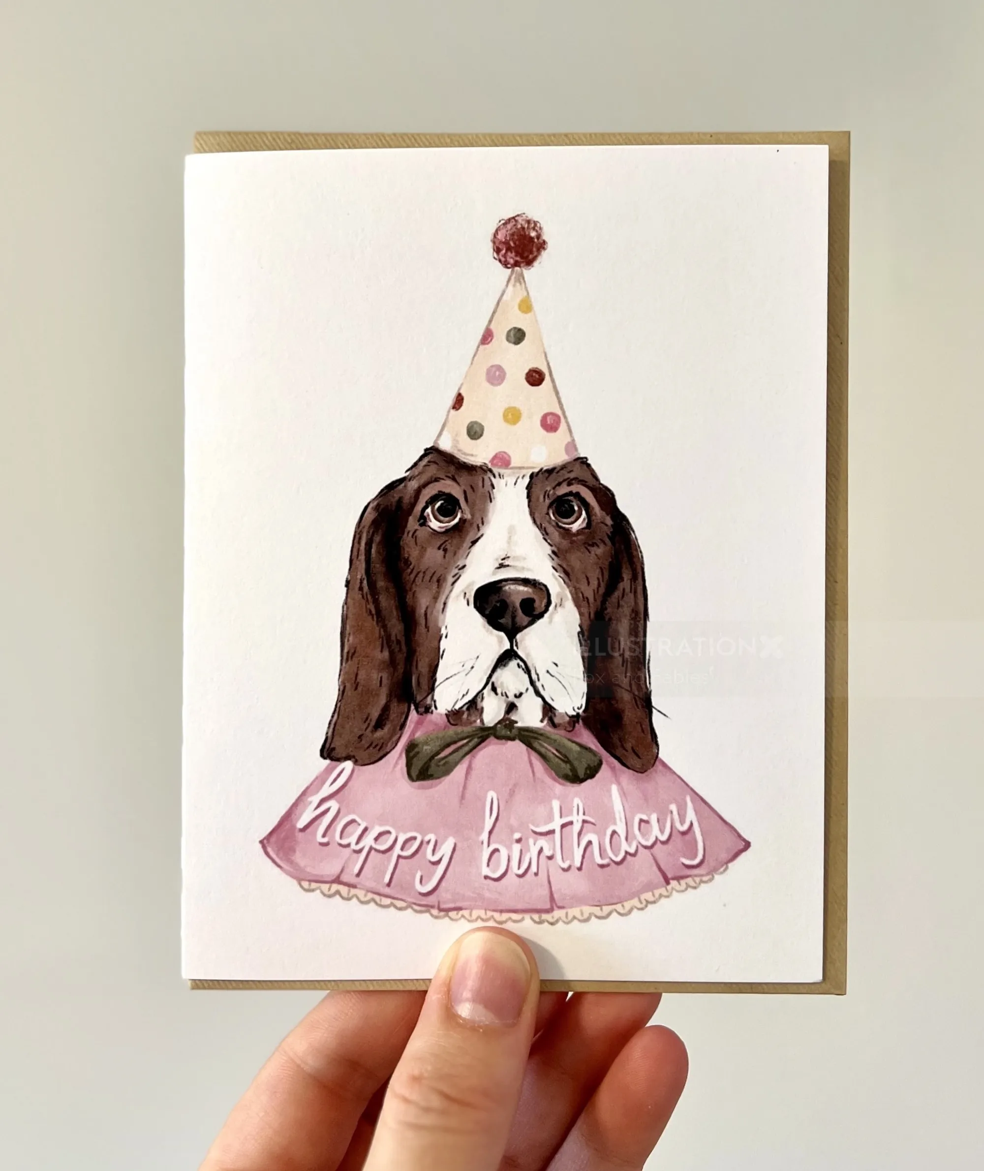 Illustration of hound dog in birthday hat and cape by Fox and Fables