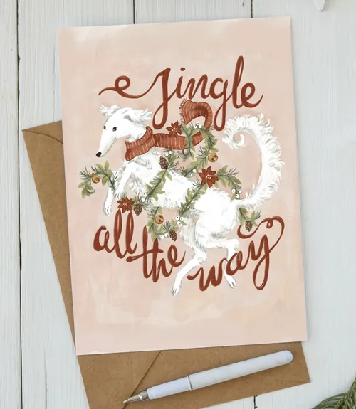 Holiday card featuring a white dog with festive decorations by Fox and Fables