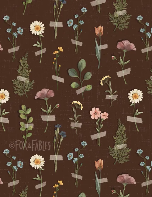 Pressed wildflowers taped on brown paper background by Fox and Fables
