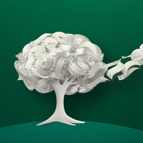 Paper sculpture of a tree and cloud