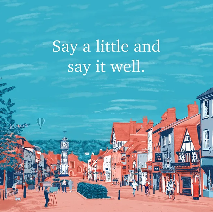 Quaint town street illustration with quote saying say a little and say it well