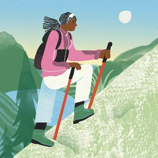 Hiker climbing hill with trekking poles in nature by Gina Rosas Moncada