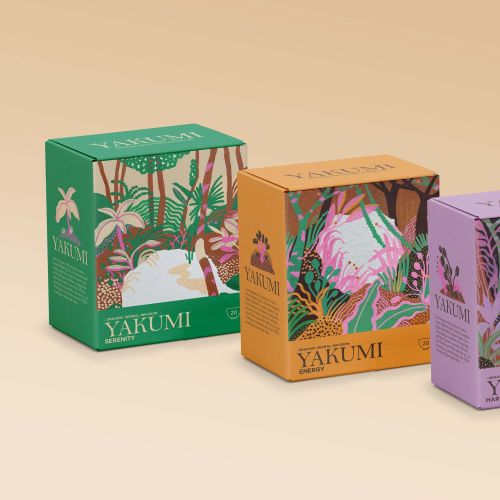 Three Yakumi tea boxes with green, orange, and purple botanical designs