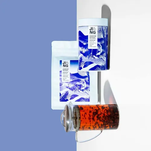 Tea packaging and glass cup with brewed tea by Gina Rosas Moncada