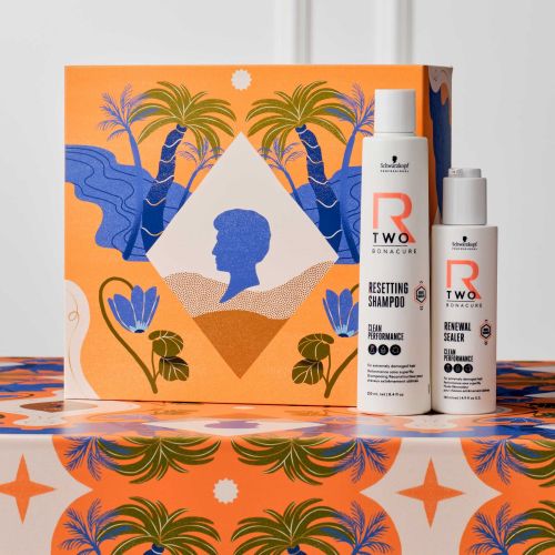 Hair care shampoo and conditioner bottles with tropical artwork by Gina Rosas Moncada