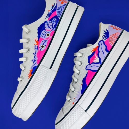 White canvas sneakers with colorful floral and bird designs by Gina Rosas Moncada