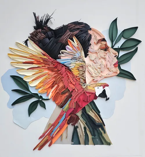 3D paper sculpture of woman’s profile with scarlet macaw by Glimpsecraft