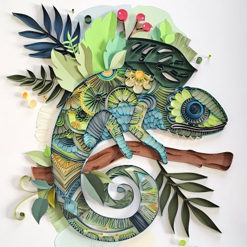 Colorful 3D paper quilling chameleon sculpture on a branch by Glimpsecraft
