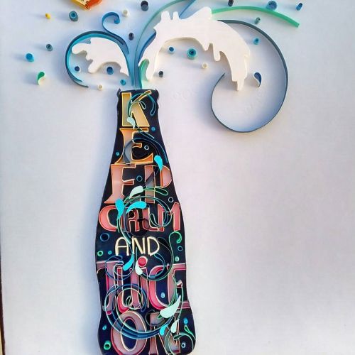 Paper quilling artwork of a juice bottle with lemon slices and splashes, artist Glimpsecraft