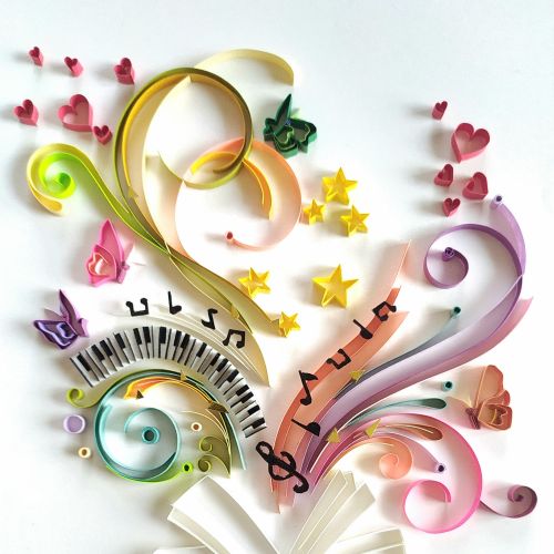 Paper quilling art of open book with colorful musical notes by Glimpsecraft