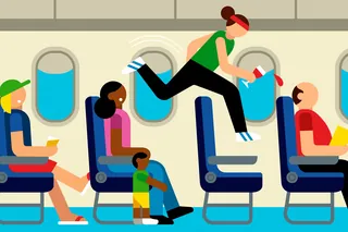 Passenger standing on airplane seat holding drink, others seated.