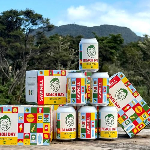 Beach Day Bright IPA cans and boxes displayed outdoors by Greg Straight