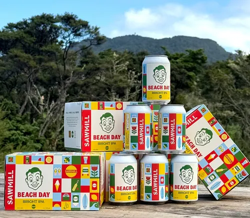 Beach Day Bright IPA cans and boxes displayed outdoors by Greg Straight