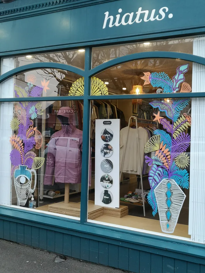Window art painting by Hannah Davies with colorful sea-themed designs