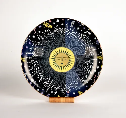 Ceramic plate with sun and star pattern by Hannah Davies