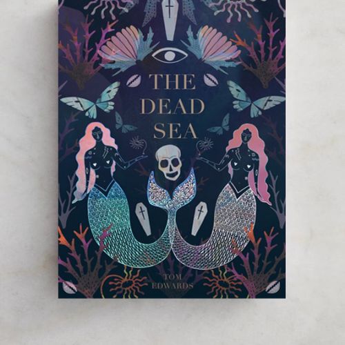 Book cover of The Dead Sea featuring mermaids and skull illustration by Hannah Davies