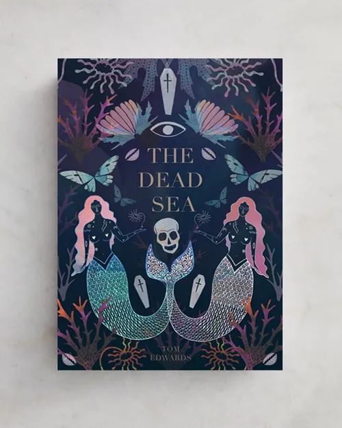Book cover of The Dead Sea featuring mermaids and skull illustration by Hannah Davies