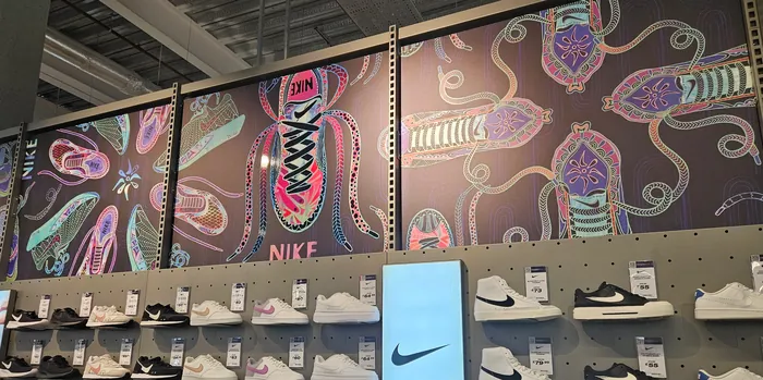 Colorful Nike mural with artistic sneaker designs in store