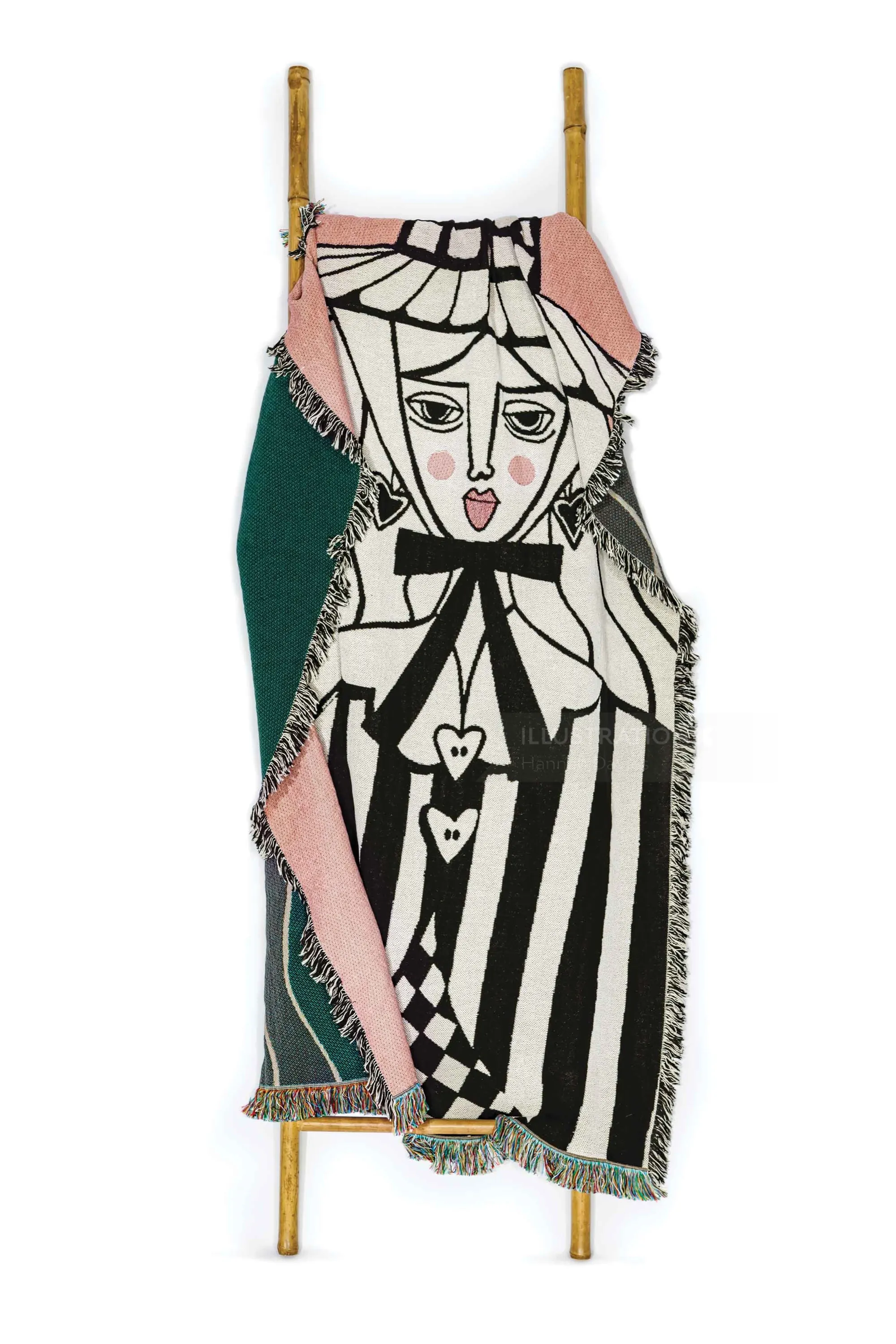 Woven tapestry with stylized female face and geometric black and white patterns