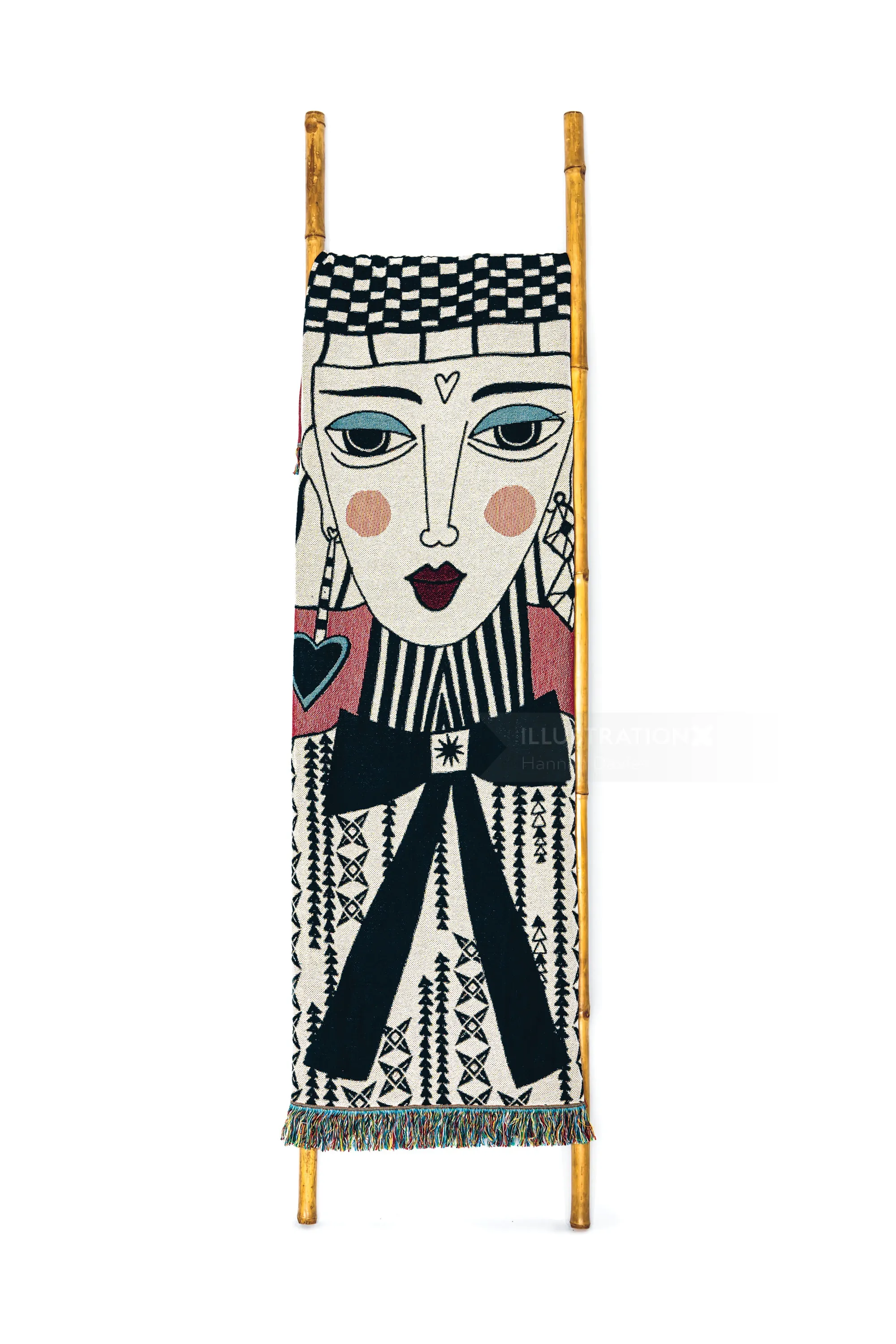 Textile wall hanging with stylized human face and geometric designs