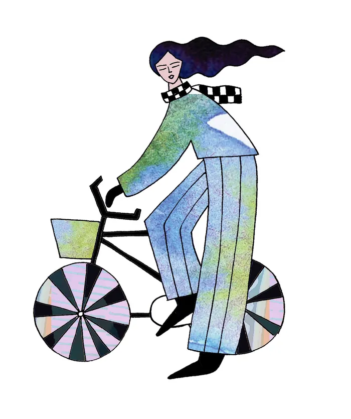 Illustration of a person with flowing hair riding a bicycle with patterned wheels