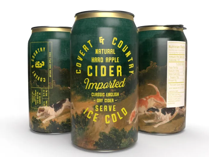 Three Covert & Country Natural Hard Apple Cider cans with nature artwork by Heather Landis
