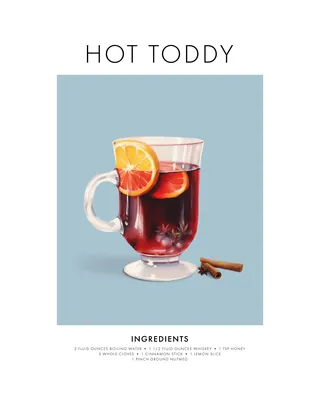 Hot toddy drink with lemon slice and cinnamon sticks