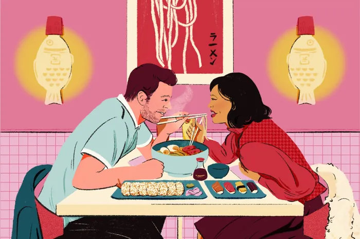 Man and woman eating sushi and noodles at a restaurant table.