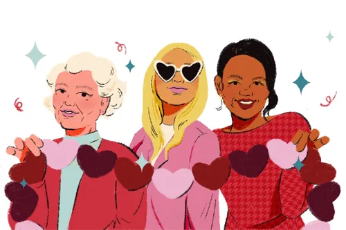 Three women holding heart-shaped decorations together