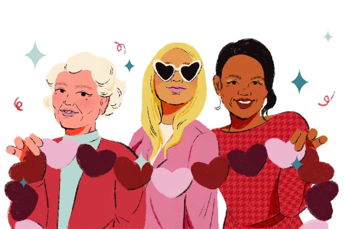 Three women holding heart-shaped decorations together