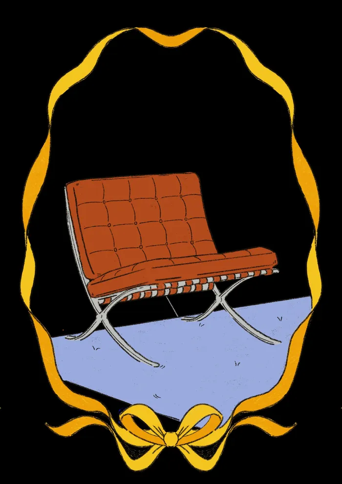 Brown leather chair reflected in decorative mirror with yellow ribbon