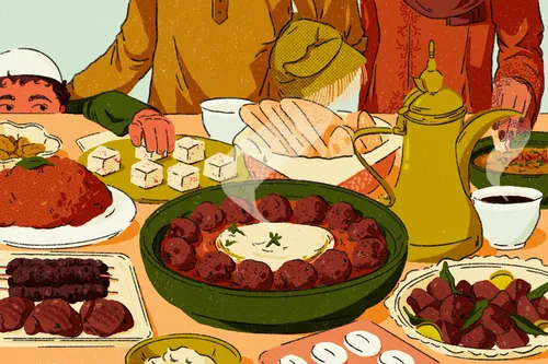 Traditional Middle Eastern meal with meatballs, rice, tea, and side dishes.