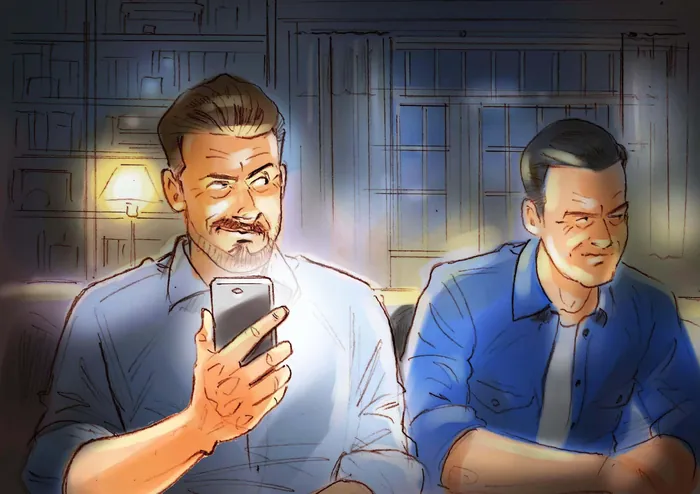Two men using smartphones indoors in dim light by Henryk Zimak