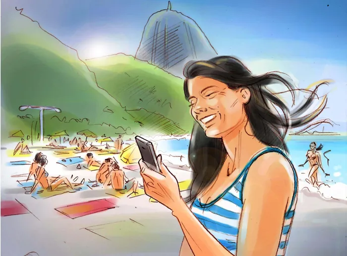 Smiling woman in striped swimsuit using phone on sunny beach near mountains