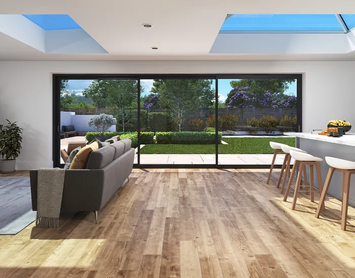 Modern living room with large bi-fold sliding doors opening to garden