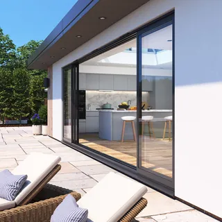 Modern home patio with large sliding glass doors and outdoor seating