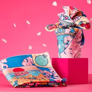 Japanese-style patterned fabric on pink background with petals