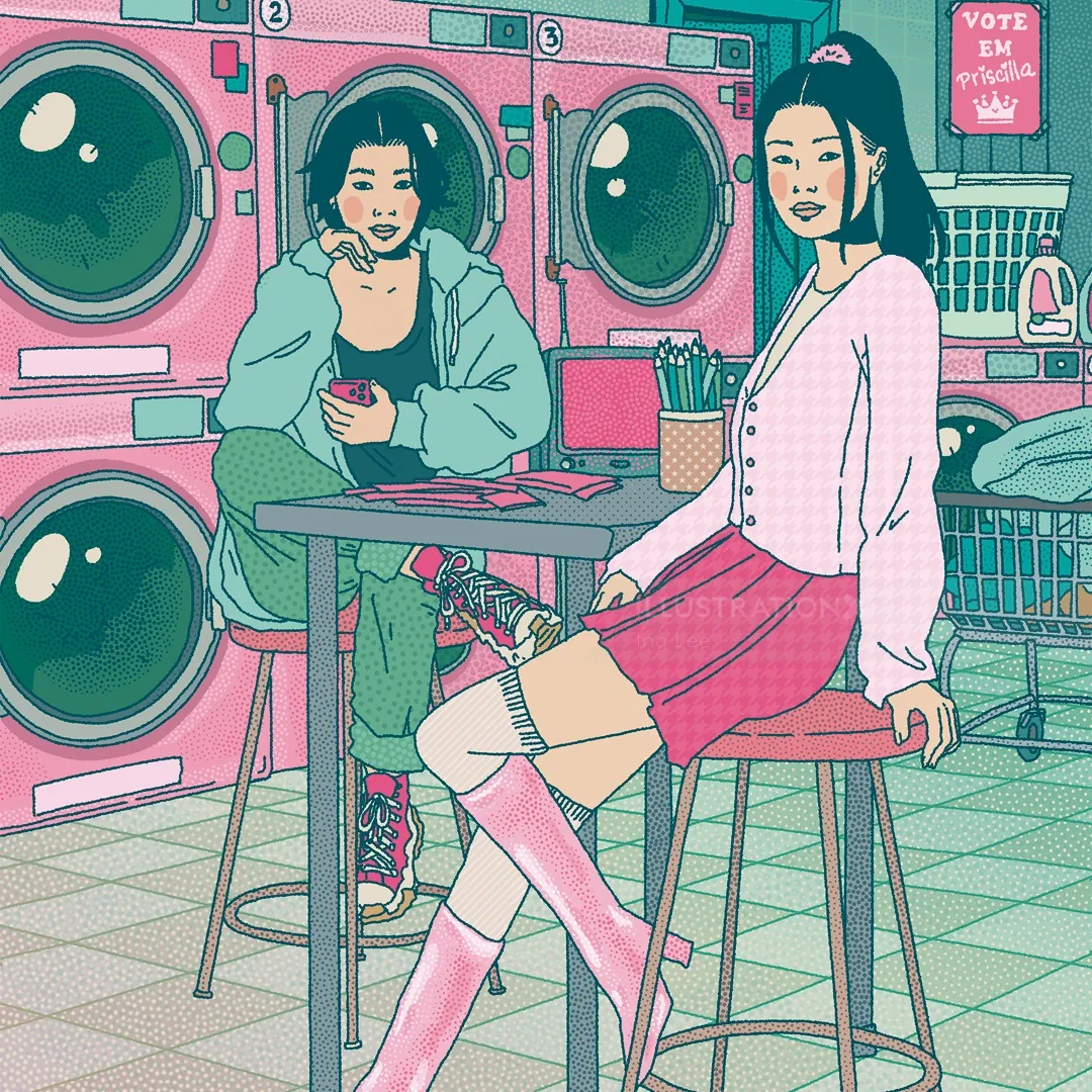 Two young women sitting in laundromat with pink and teal machines