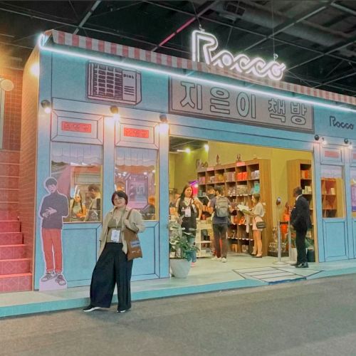 Almond book promotional stand with neon lights at Sao Paulo Book Biennale