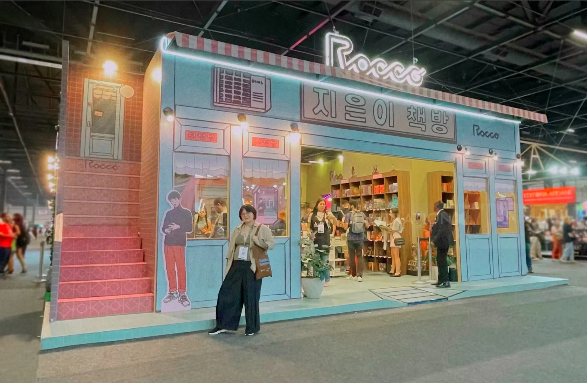 Almond book promotional stand with neon lights at Sao Paulo Book Biennale
