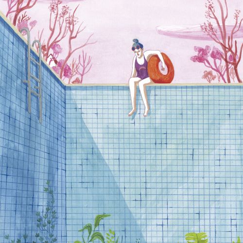 woman sitting at an empty pool