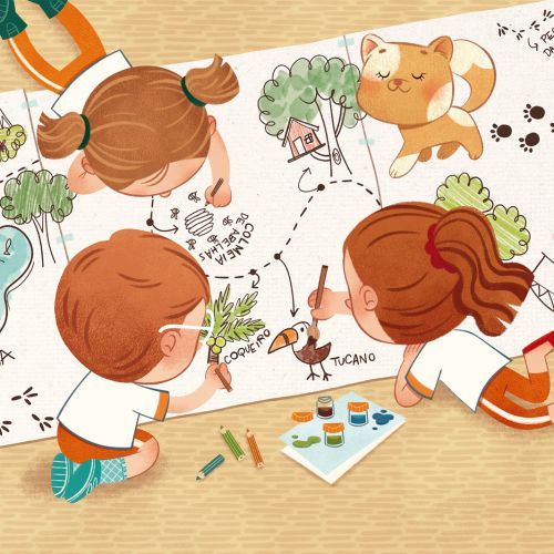 Children drawing and painting together on large paper