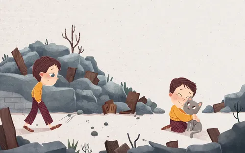 Boy playing with cat near rocks and wood debris