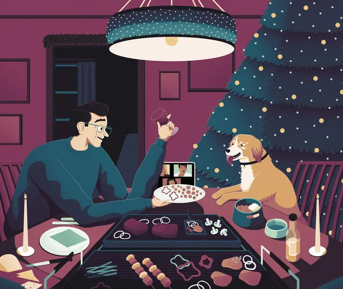 A man decorating cookies with his dog watching by a Christmas tree by Jacob Stead