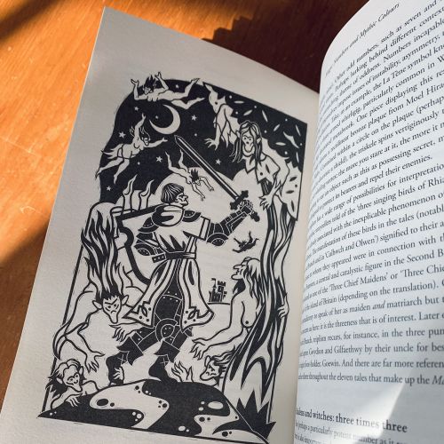 Black and white illustration of a knight with a sword amidst trees