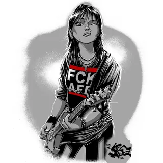 Punk rocker playing electric guitar, wearing a graphic shirt and chains.